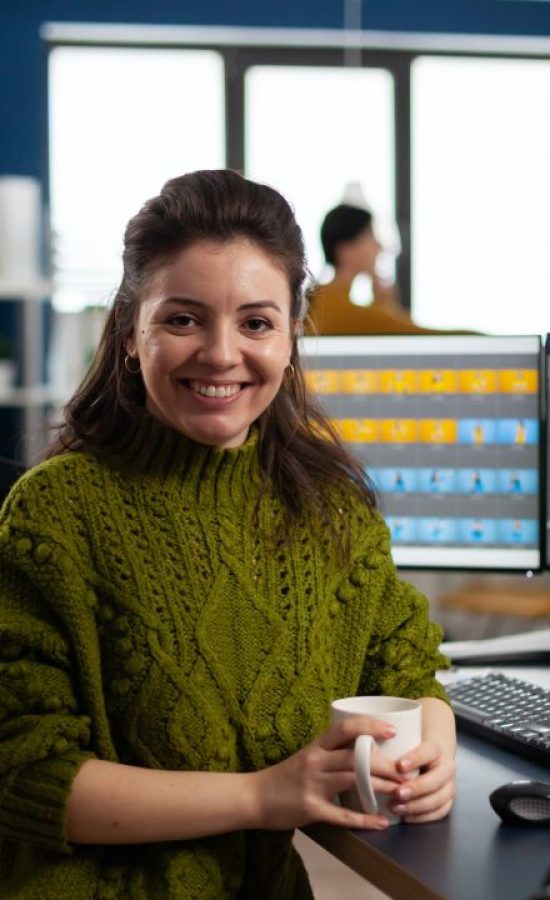 woman-retoucher-looking-at-camera-smiling-working-in-creative-media-agency.jpg